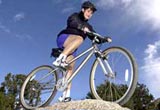 Jean mountain biking.