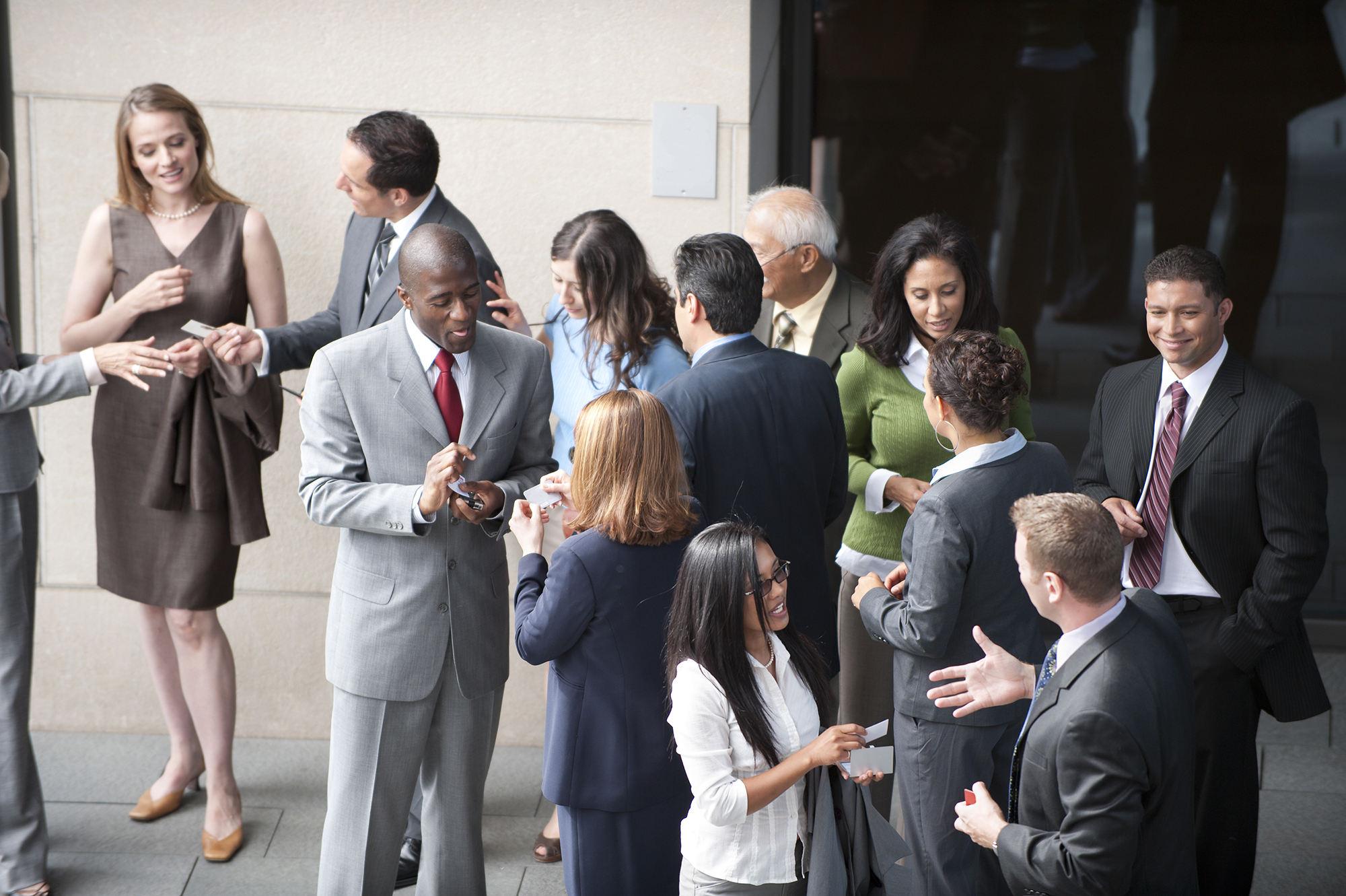 People having discussions outside of building