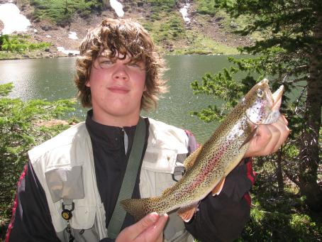My son Evan with a trout he caught at Green Lake fly fishing