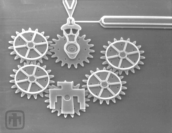 All gears are driven sequentially by the drive gear (top center). The fixed guide plates (mounted to the tops of the gears' shafts) are clearly visible. Gear chains such as this one have been driven at speeds up to 250,000 RPM.
