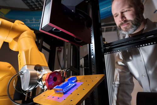 Man watching functioning Alinstante machine