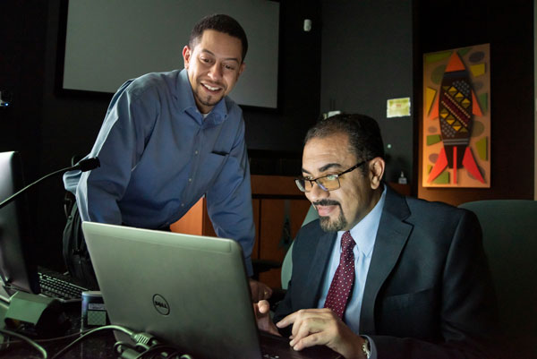 MIRaGE — Multiscale Inverse Rapid Group-theory for Engineered-metamaterials team member Charles Reinke, left, and principal investigator Ihab El Kady