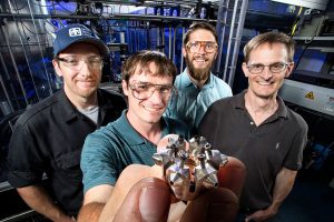 SILVER — Ducted Fuel Injection team, from left, Nathan Harry, Christopher Nilsen, Drummond Biles and principal investigator Charles Mueller (Photo by Randy Wong)