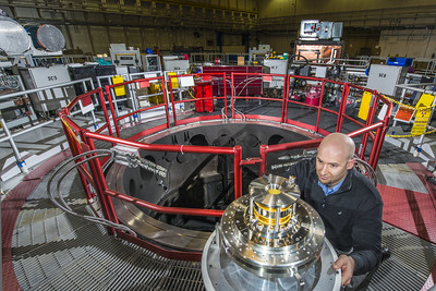 A technician gets a target ready for the center section in the Z machine pulsed power facility