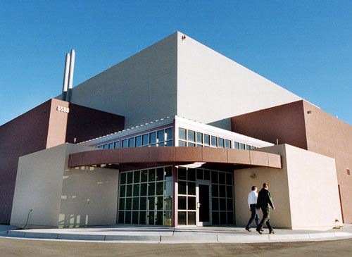 Two colleagues walking outside of GIF building, located in Albuquerque, NM.