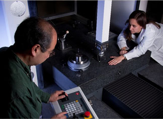 Two researchers observing dimensional measurement systems