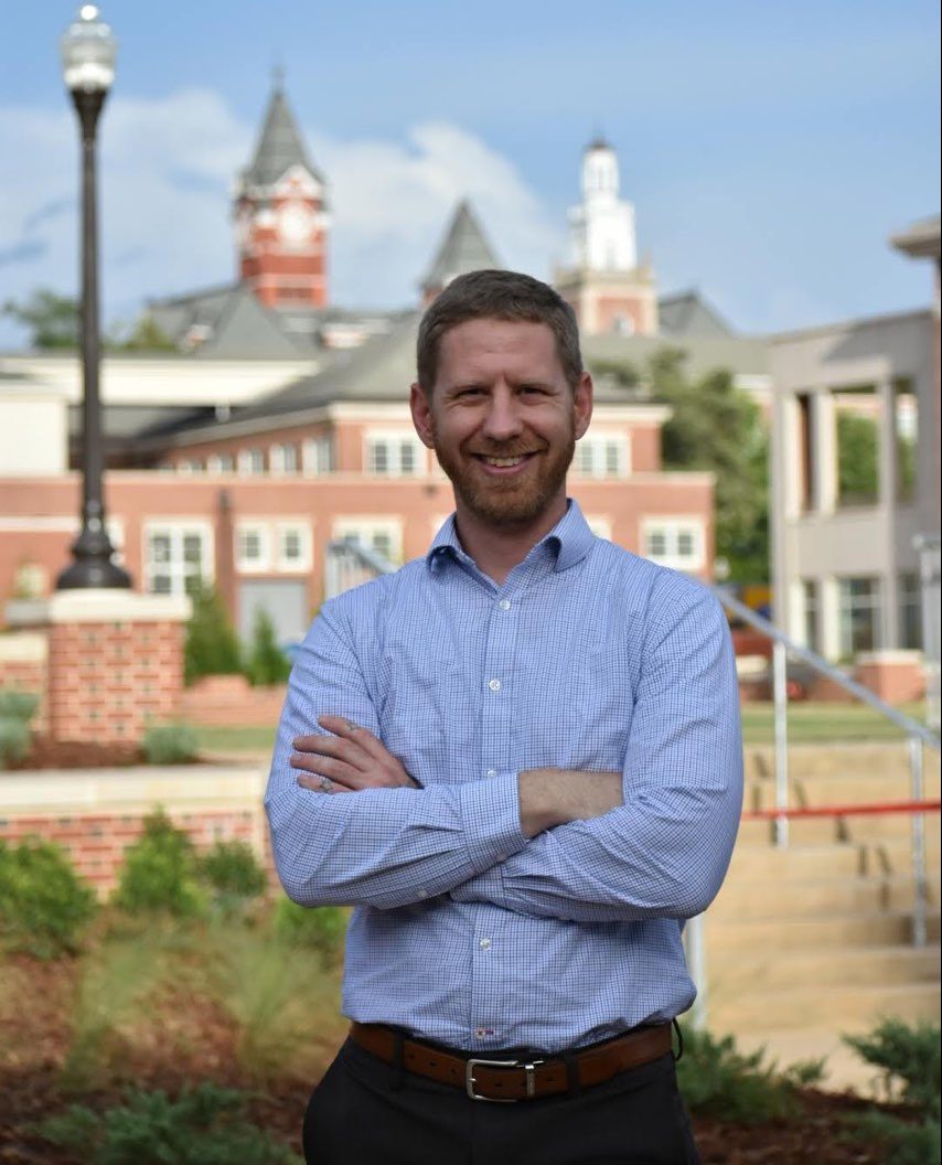 Jonathan Pegues stands in front of a building of Auburn University