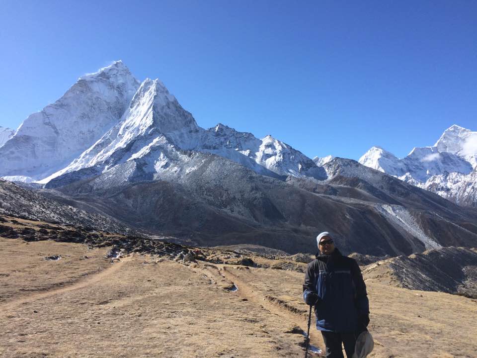 Umakant Mishra stands at the bottom of Mount Everest.