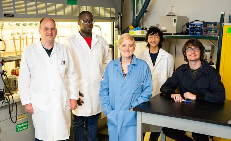 Materials scientist and principal investigator Erica Redline (center) led the R&D 100 Award winning research team helping make materials more durable. (Photo by Craig Fritz)