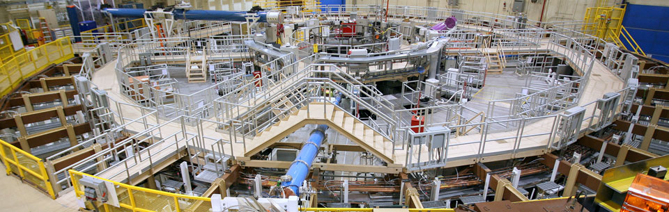 Z machine scientist examines one of the aluminum cylinders used in the Z pulsed power experiments. The monitor on the X-ray machine in the background displays a highly magnified, pre-experiment view of the wavering edges machined into the outside edge of the cylinder. These were used to intentionally start the growth of the instability. Read more:
bit.ly/2YVSbSv