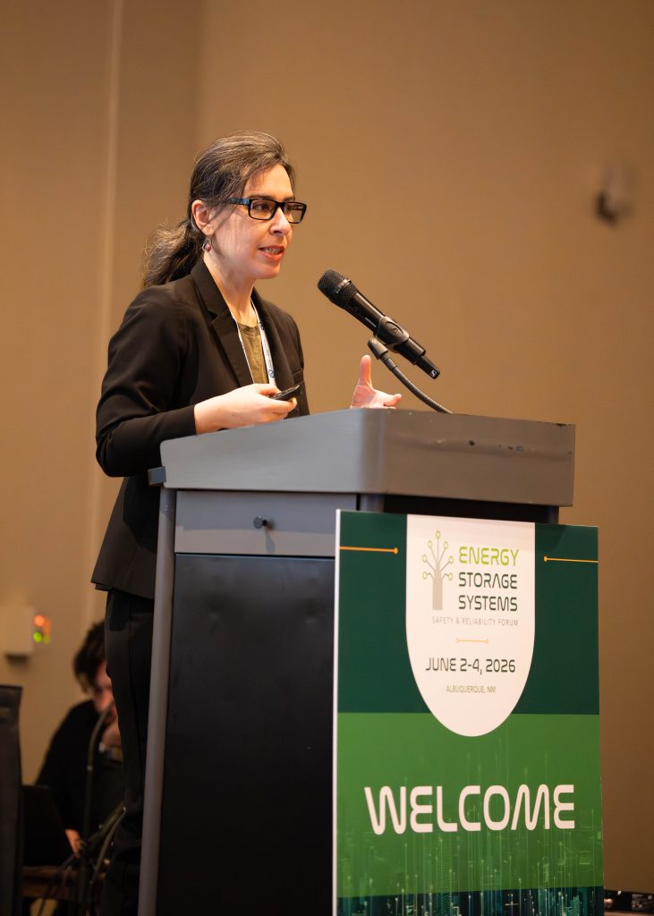 Yuliya Preger, researcher at Sandia National Laboratories and one of the event organizers, welcomes attendees to the 2026 Energy Storage Systems Safety & Reliability Forum. / Credit: Alicia Bustillos, Sandia National Laboratories
