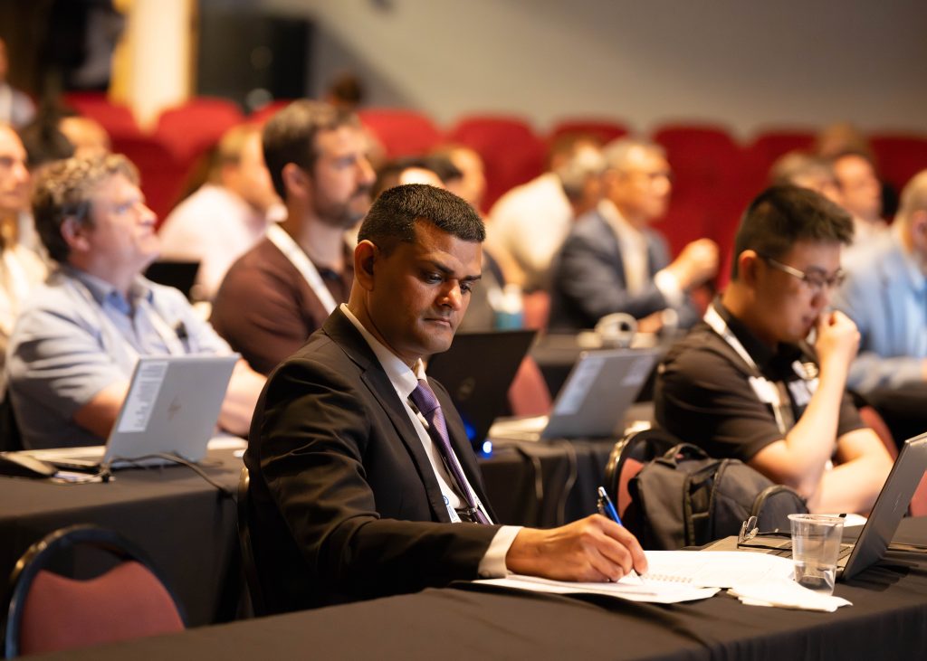 Mohamed Kamaludeen, technical program manager at the DOE Office of Electricity, takes notes at a technical session a the 2026 Energy Storage Systems Safety & Reliability Forum. / Credit: Alicia Bustillos, Sandia National Laboratories