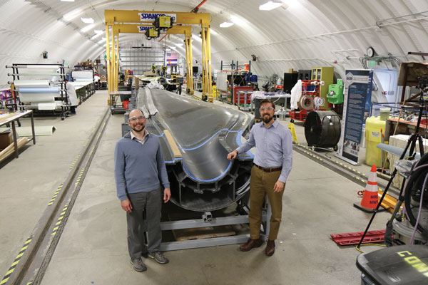 David Maniaci and Brian Naughton stand next to the 3D printed blade mold.