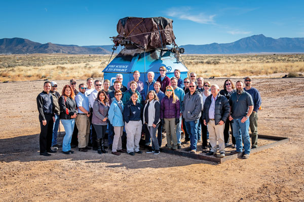 Sandia crude oil project team assembles in front of the fireball test tank
