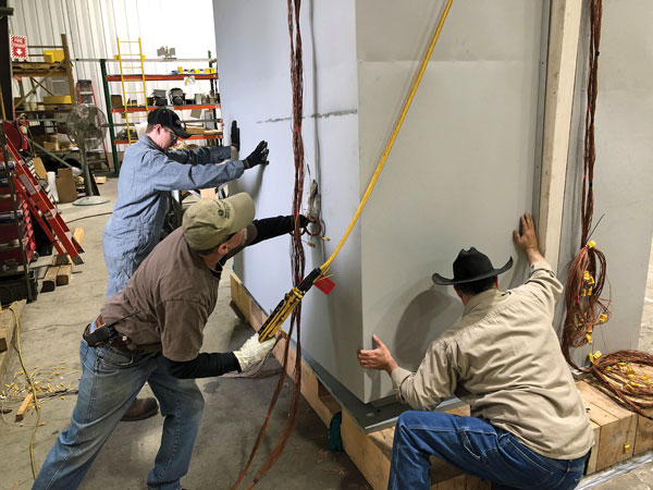 Technicians repair damaged field test equipment