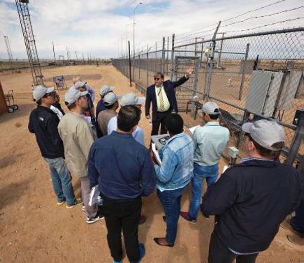 Larry Miller demonstrates fence vibration sensor for visitors