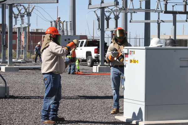 people working on energy infrastructure