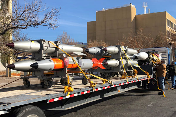 rack of missiles loaded on a flatbed trailer