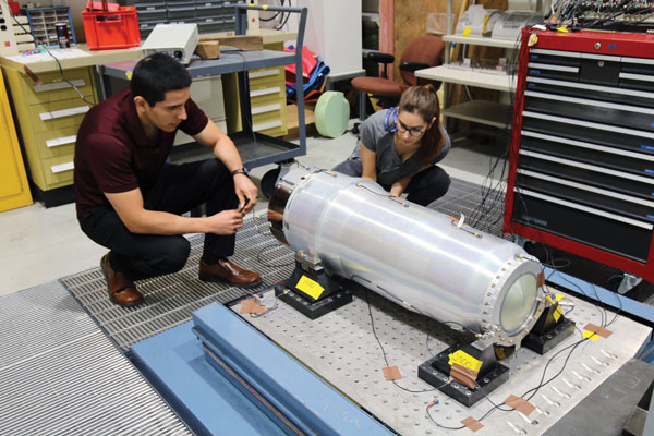 technicians work on bomb assembly