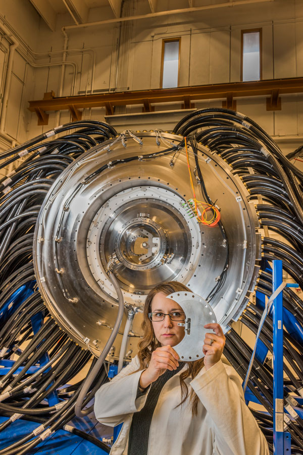 Nicole Cofer in front of pulsed power accelerator