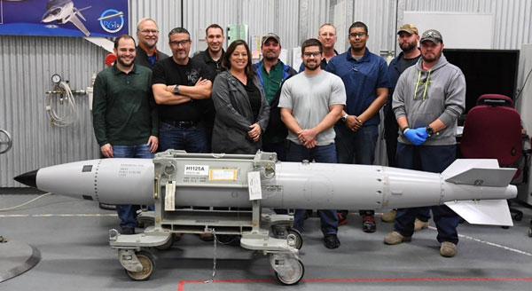 team poses with assembled B61-12 trainer