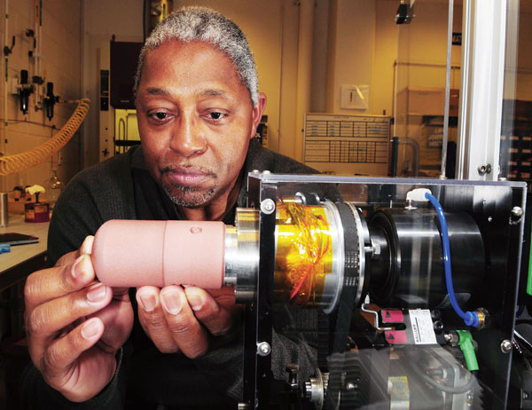 Moses Jones works on neutron generator
