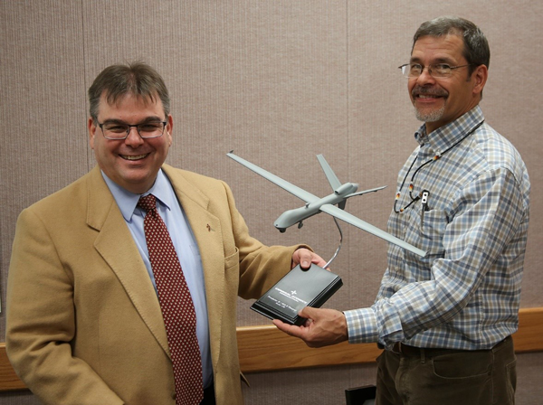 John Fanelle and Steven Castillo pose with model plane