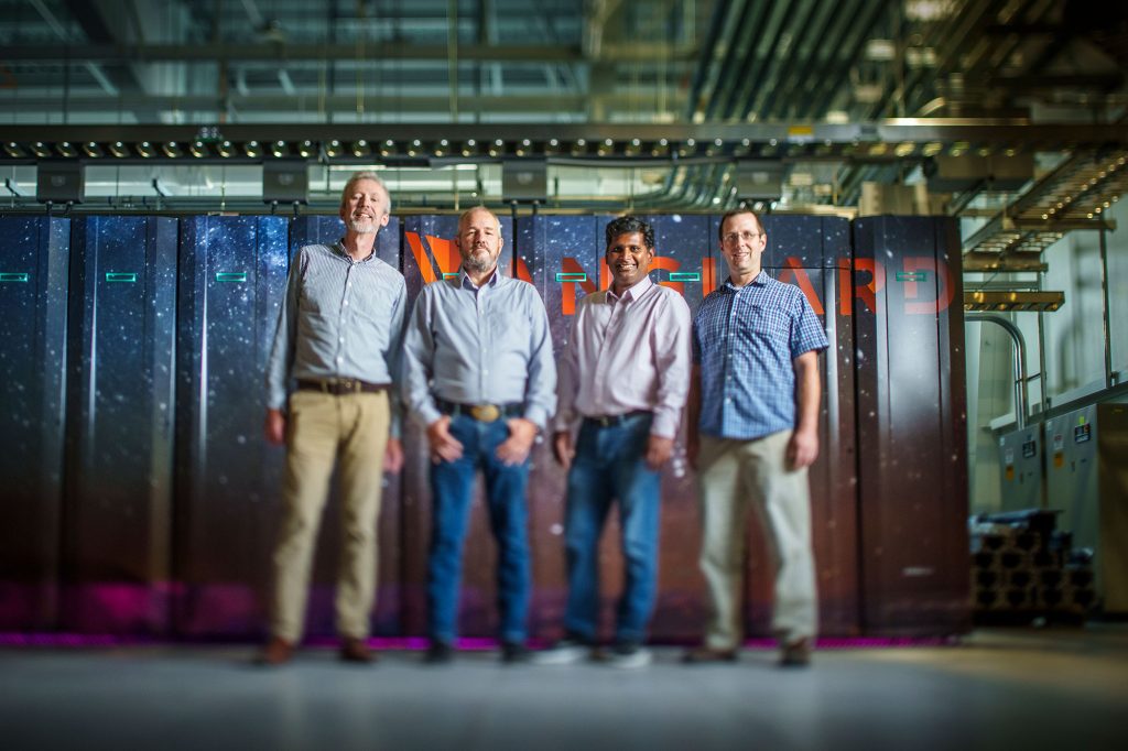 The Advanced Memory Technology program team in front of Vanguard supercomputer.