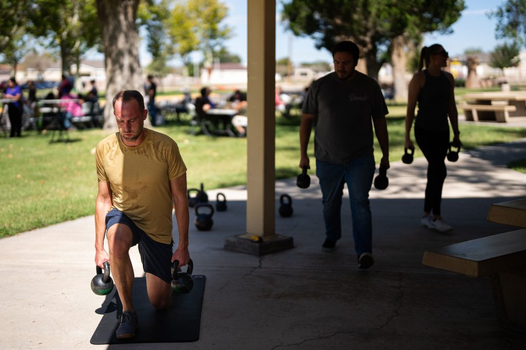 Sandians participate in a class with Sandia Medical during Employee Health and Well-Being Day at Hardin Field. The class demonstrated offerings by the Preventive Health group.