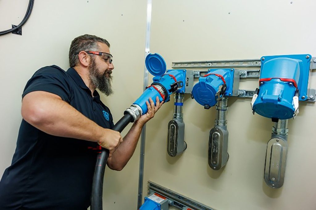A test operations engineer works in the new Medium Voltage Laboratory.