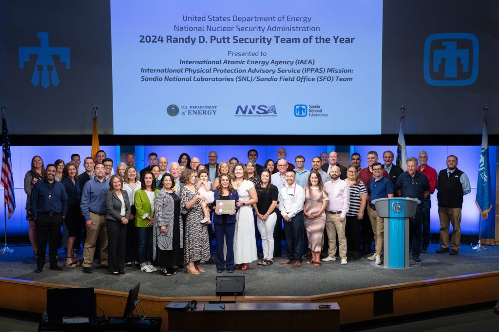 Safeguards and Security Director Samantha Flores accepted the award on behalf of 70 dedicated individuals from five centers across divisions 1000, 4000, 6000 and 9000, and each individual contributor received a certificate.