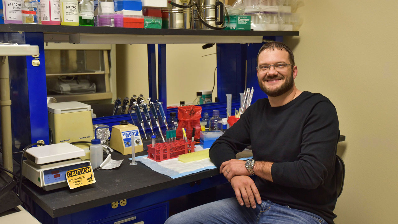 Lab design expert Bill Arndt sits in a biosafety demonstration lab