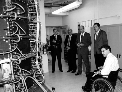 Neal Fornaciari (right), explains Sandia's furnace research at the CRF to John Crawford, Jim Tegnelia, Norm Augustine, and Bill McLean, 1993