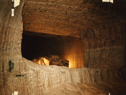 After initial excavation by drilling and blasting, mechanical miners were brought in; the drum miners left thick ridges on the tunnel's side, 1978