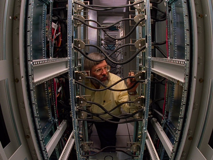 Prior to the dedication of ASCI Red at Sandia in June 1997, Sandian Michael Hannah inspected cables in one of the machines