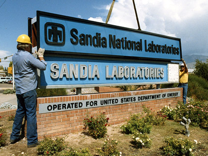 Installing the new Sandia National Laboratories sign in front of the main entrance in Albuquerque, New Mexico, 1979