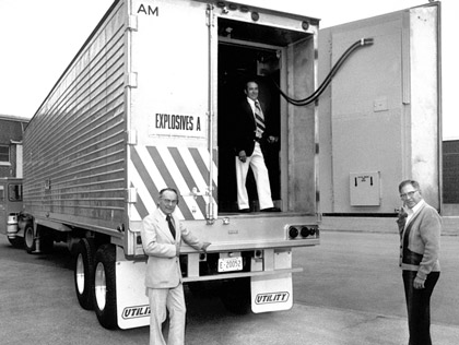 Robert Reed, Loren Bishop and James Taggart with Sandia's safe and secure trailer (SST) for the transport of nuclear materials, 1970