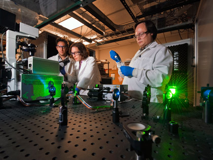 Jesse Aaron, Jeri Timlin, and Bryan Carson working with imaging techniques developed to view cell-level activity with unprecedented detail, 2011
