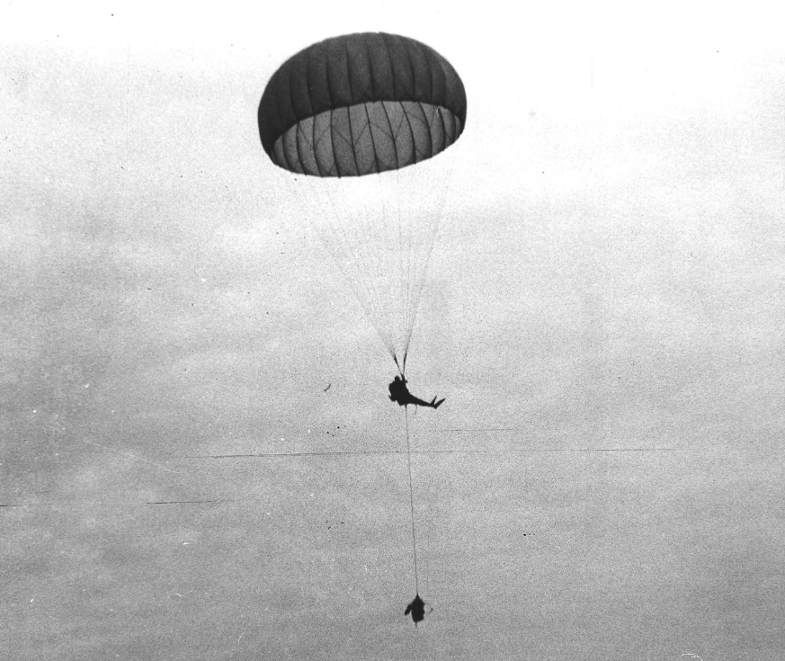 Diver descending by parachute with SADM, 1965