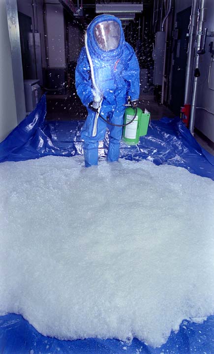 Sandia Decon Formulation co-developer Maher Tadros demonstrates application of the formulation from a pressurized canister. The foam could be sprayed from handheld canisters or from trucks, or it could be incorporated into high-profile government military buildings. The formulation is non-toxic. Protective clothing is required to protect decontamination personnel from chemical and biological agents.