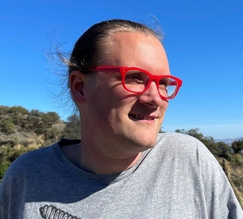 Pieterjan looking off in the distance smiling