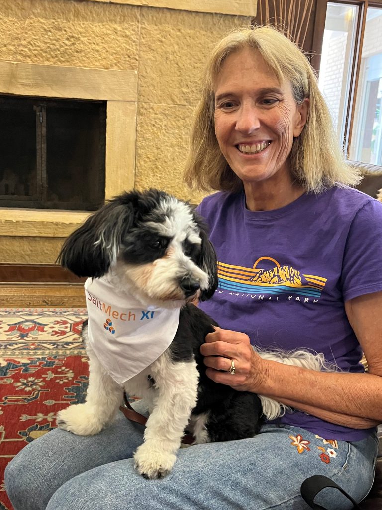 Retired Sandian Keri Sobolik holds Bingley, the unofficial SaltMech XI mascot (Photo by Steven Sobolik)
