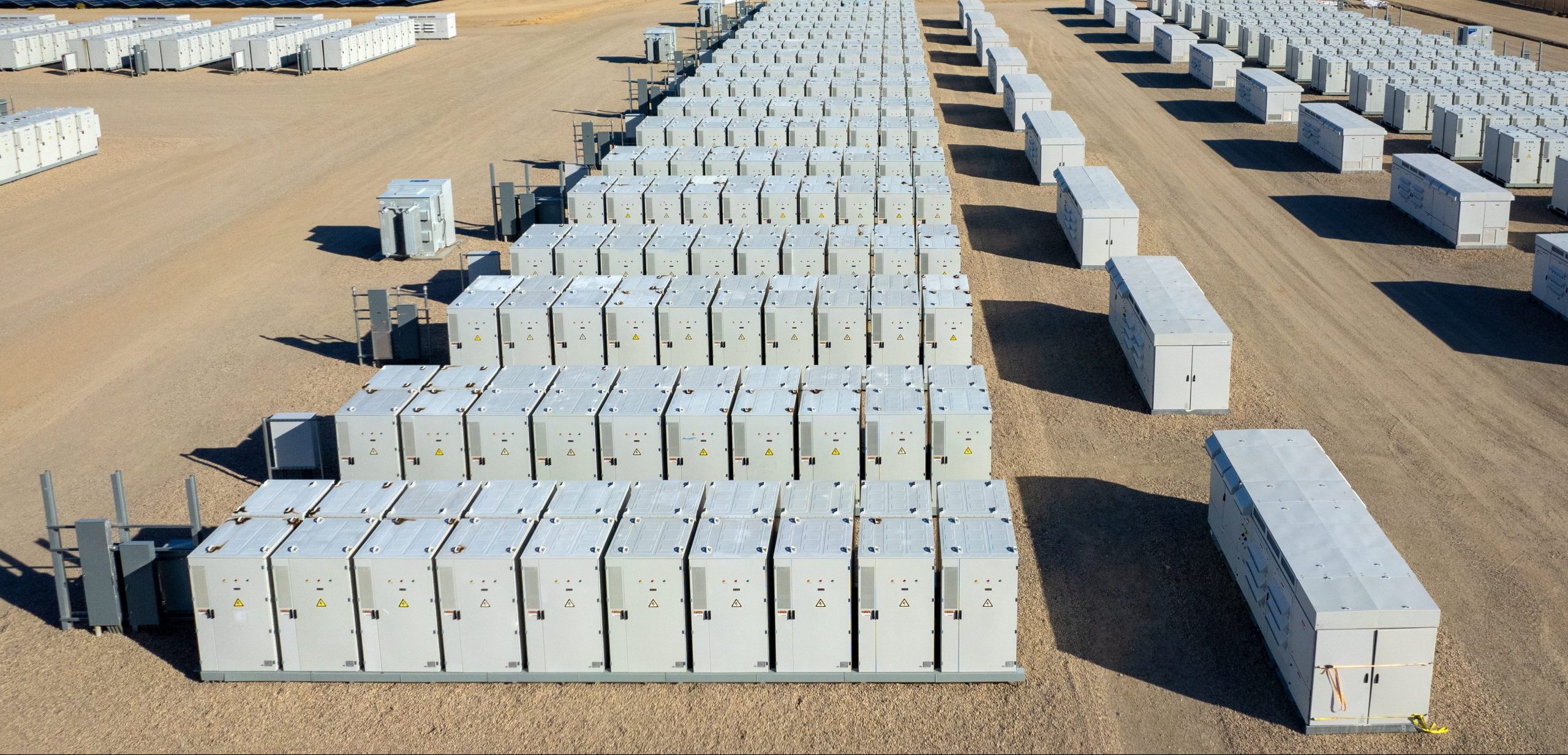 Photo: Aerial view of industrial battery units storing electricity in the desert. / Credit: Getty Images