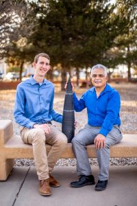 Graham Monroe, left, and Sal Rodriguez display the dimpled rocket nose they built as part of a collaboration between Sandia and the University of New Mexico. (Photo by Jennifer Plante) Click on the thumbnail for a high-resolution image.
