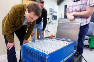 Brad Theilman, a computational neuroscientist at Sandia National Laboratories, helped discover that nature-inspired, neuromorphic computers, like the one shown here, are better at solving complex math problems than previously thought. (Photo by Craig Fritz) Click on the thumbnail for a high-resolution image.