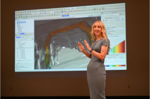 Megan Ford of Aperi Computational Mechanics Consulting presents a new capability in Aperi software that uses high-resolution 3D scan data to predict the long-term stability of nuclear waste storage tunnels. (Photo by Bret Latter) Click on the thumbnail for a high-resolution image.