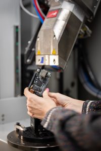 <strong>Noelle Collins sets up for an X-ray CT scan of a circuit board as part of the Non-Destructive Evaluation group at Sandia National Laboratories.</strong> (Photo by Craig Fritz) Click on the thumbnail for a high-resolution image.