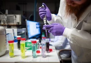 <strong>Nathan Bays prepares sample solutions to test the ISA-DESI technique used to detect PFAS at Sandia National Laboratories</strong>. (Photo by Craig Fritz) Click on the thumbnail for a high-resolution image.