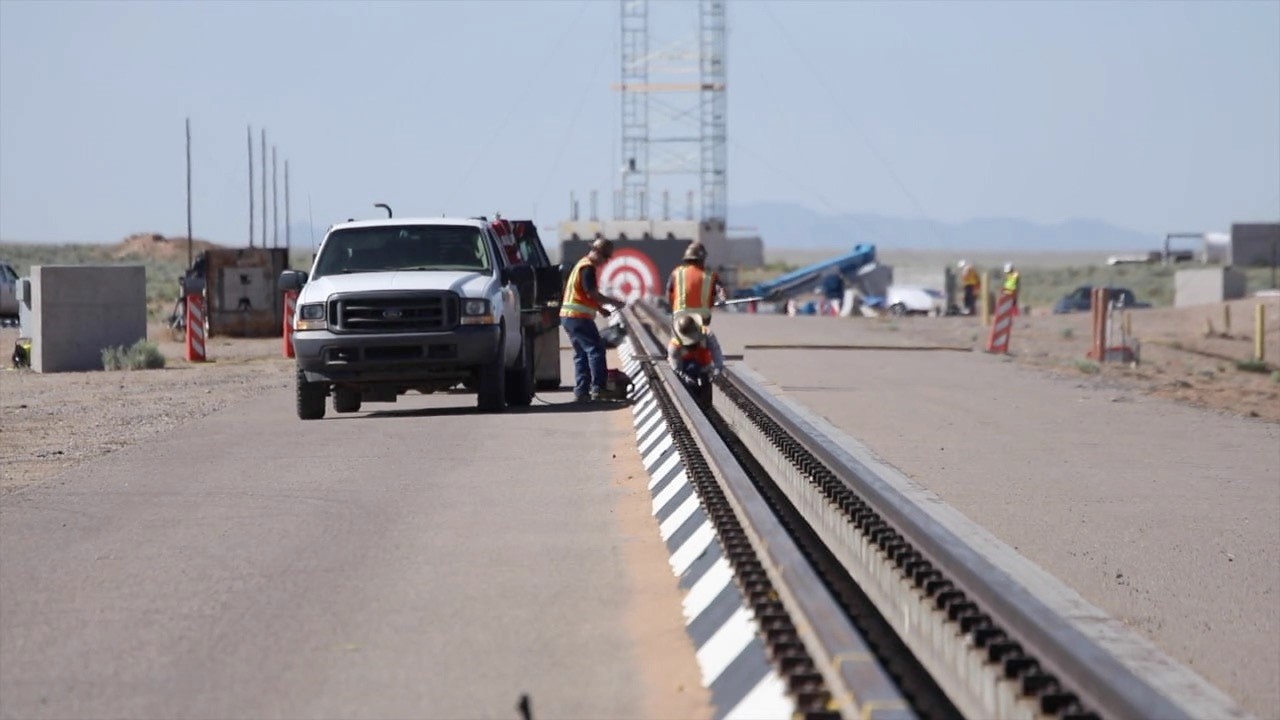 Workers Prepare for a Test at the Rocket Sled Track