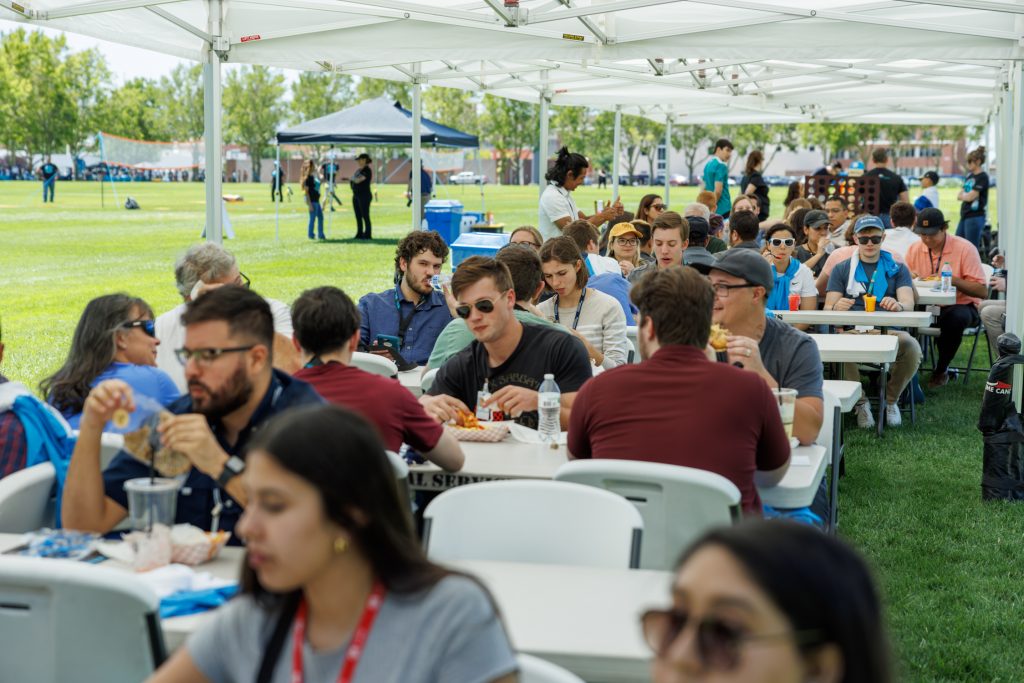 Interns eating together during Sandia Welcome Event